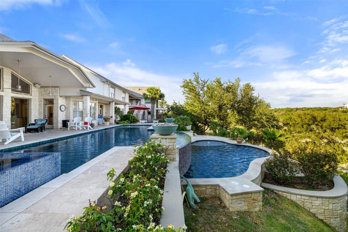 805 Brooks Hollow Road Lakeway, TX 78734 - Photo 26 of 38 a balcony with table and chairs