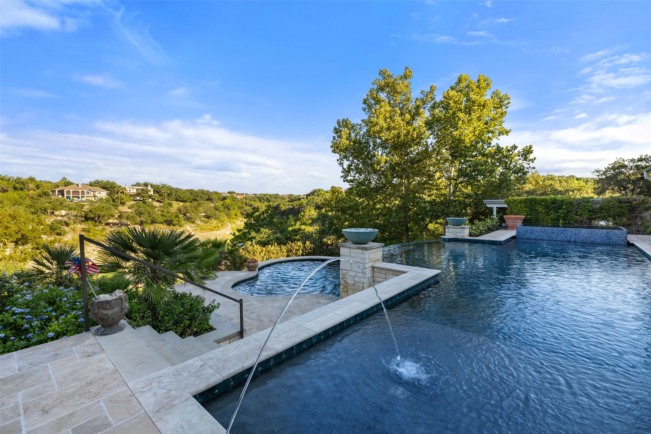 805 Brooks Hollow Road Lakeway, TX 78734 - Photo 27 of 38 a view of a terrace with a garden