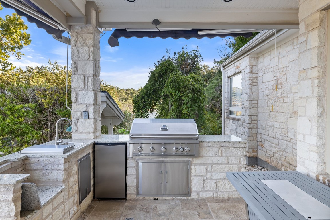 805 Brooks Hollow Road Lakeway, TX 78734 - Photo 29 of 38 a view of a house with a balcony