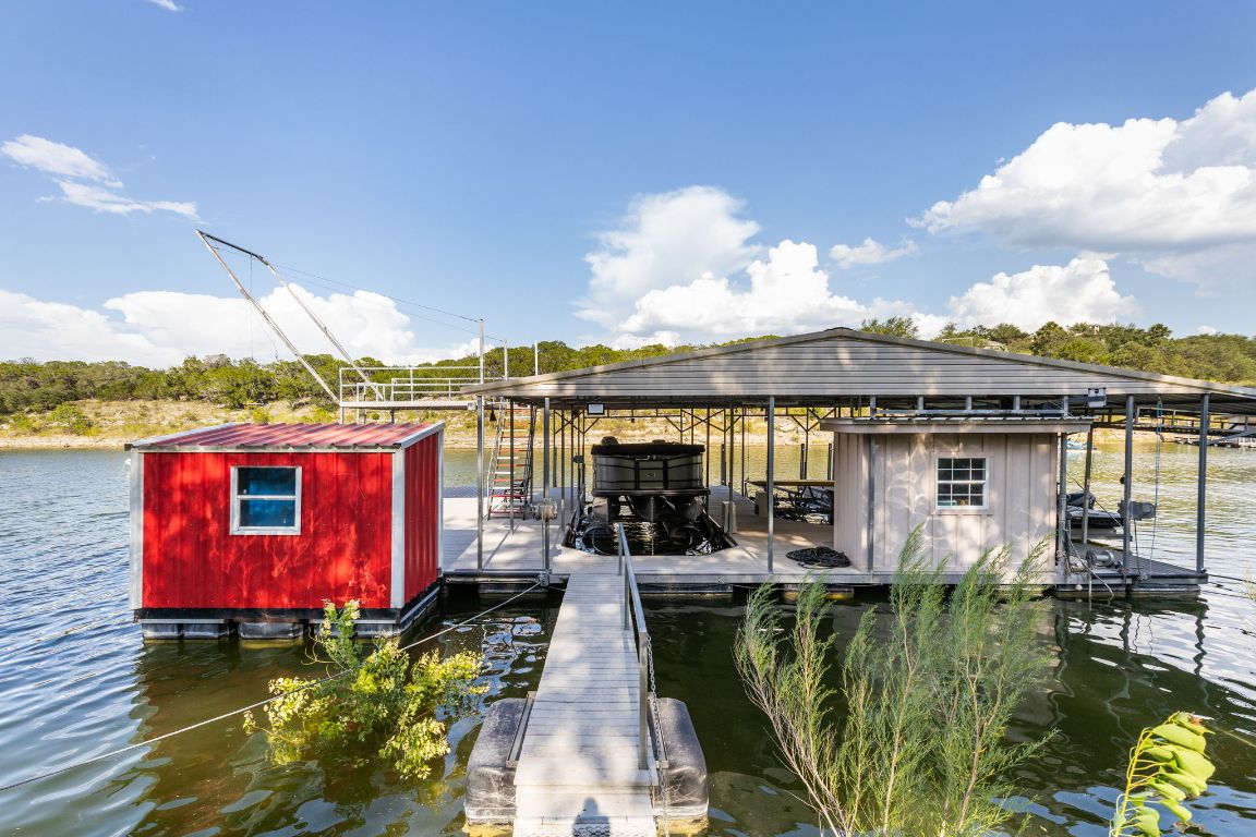 805 Brooks Hollow Road Lakeway, TX 78734 - Photo 30 of 38 swimming pool view with a seating space and a hardwood floor