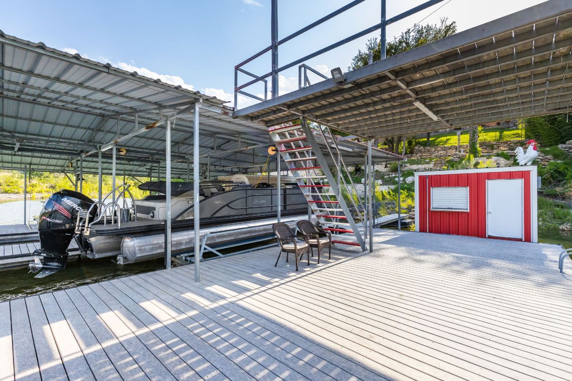 805 Brooks Hollow Road Lakeway, TX 78734 - Photo 32 of 38 a view of a swimming pool with a patio