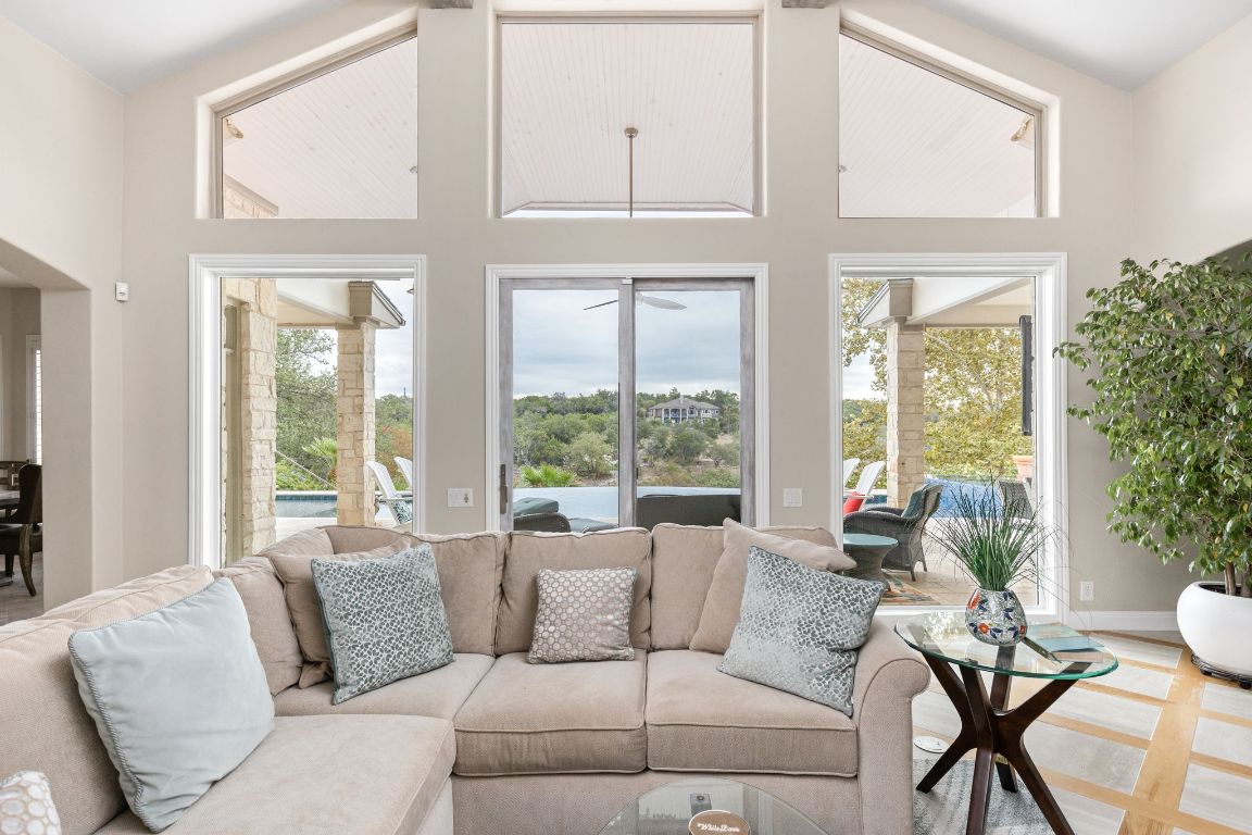 805 Brooks Hollow Road Lakeway, TX 78734 - Photo 8 of 38 a living room with furniture and large windows