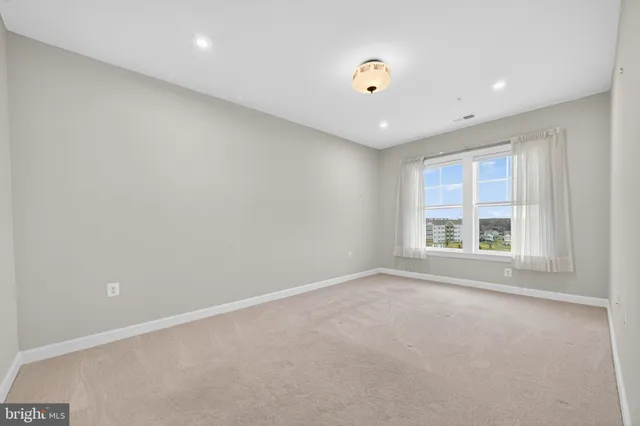 a bathroom with double sink and a mirror