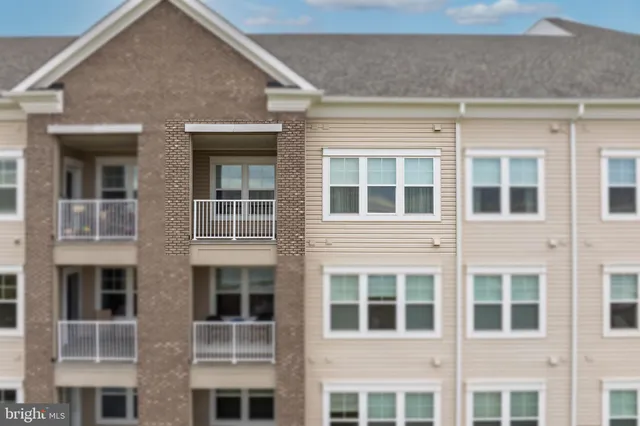 a large building with a yard in front of it