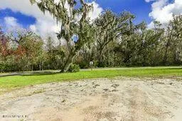 a view of an ocean and a yard