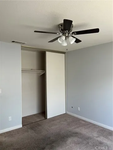 a view of hallway with wooden floor