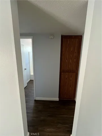 a view of a livingroom with a ceiling fan and window