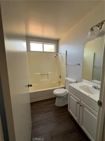 a view of backyard with wooden fence