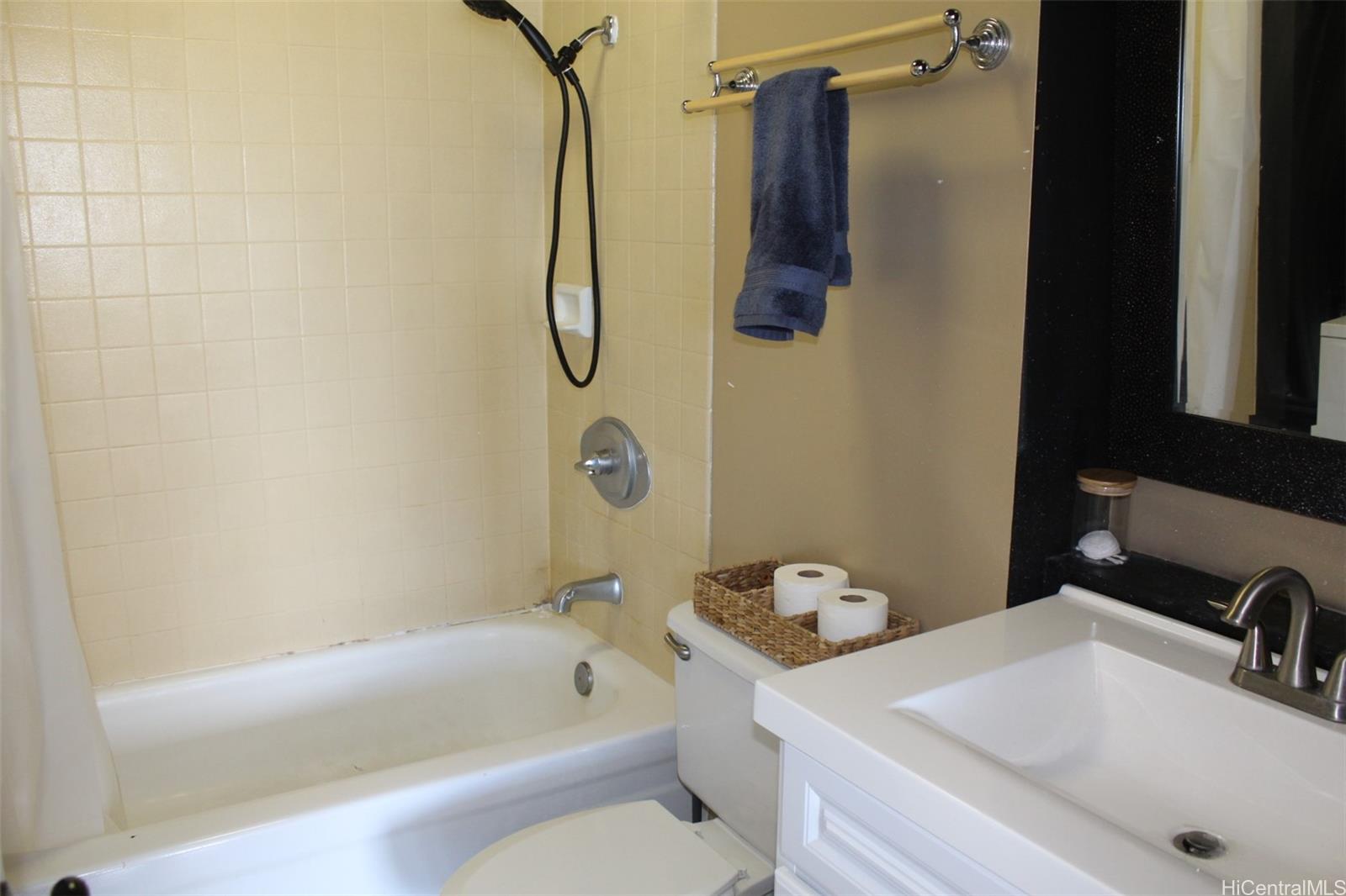 775 Kinalau Place, Unit 2107 Honolulu, HI 96813 - Photo 12 of 13 a bathroom with a sink a toilet and shower