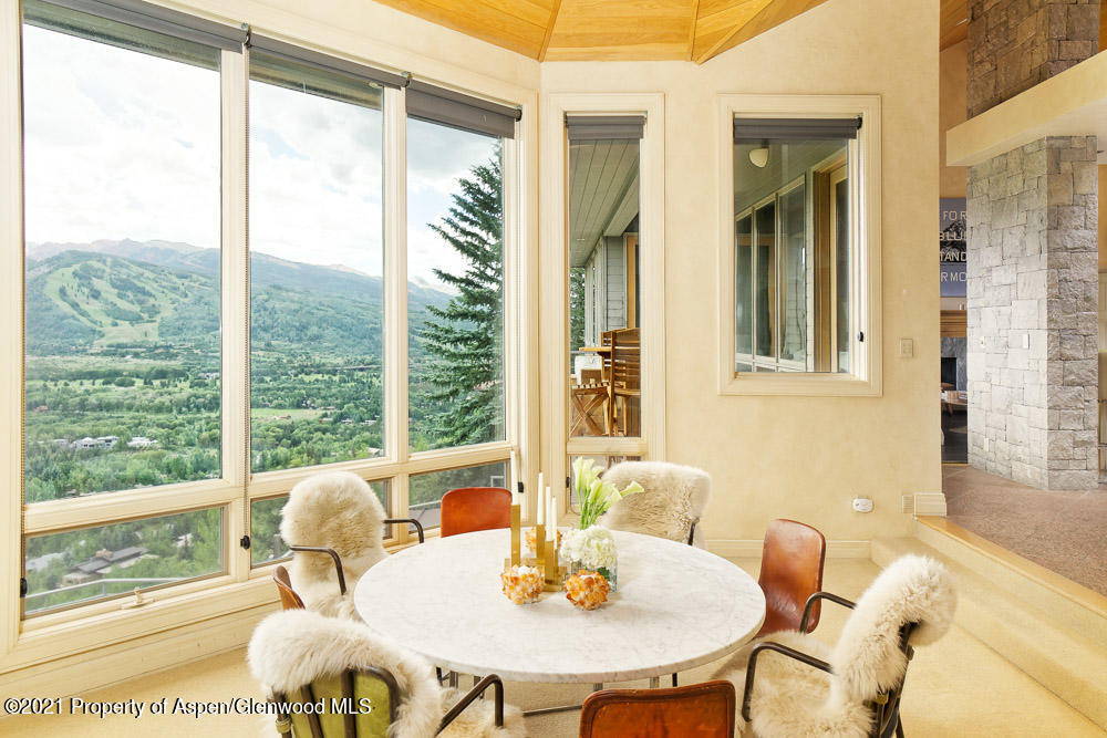200 West Reds Road Aspen, CO 81611 - Photo 12 of 31 a view of a dining room with furniture and a window