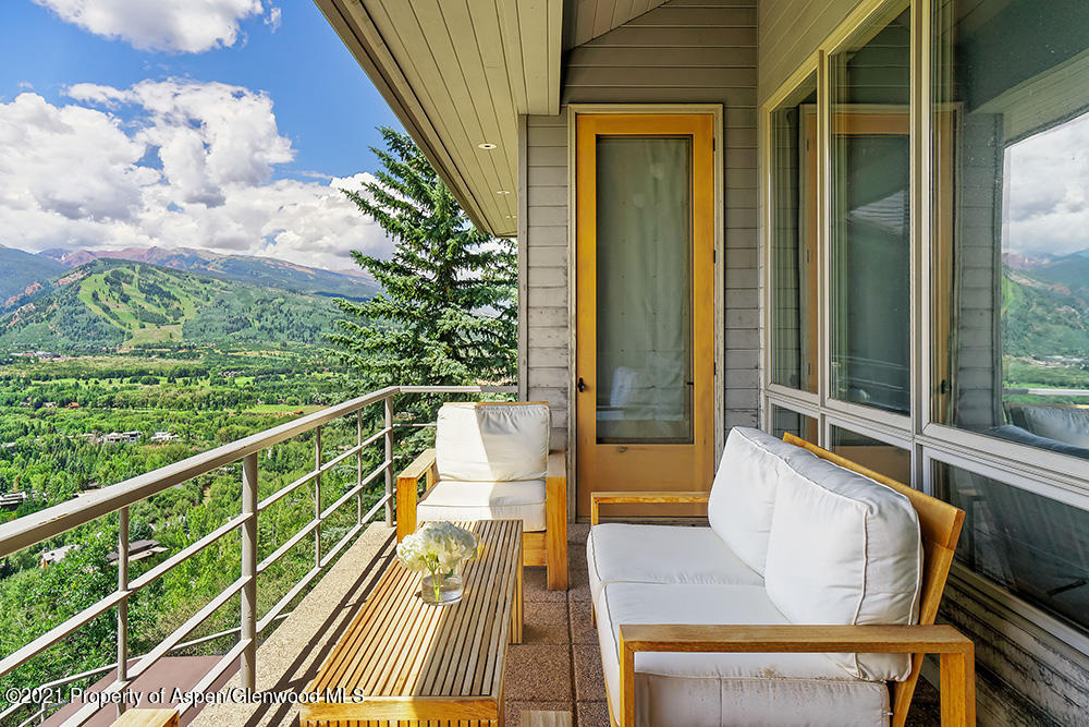 200 West Reds Road Aspen, CO 81611 - Photo 14 of 31 a view of balcony with wooden floor and outdoor seating