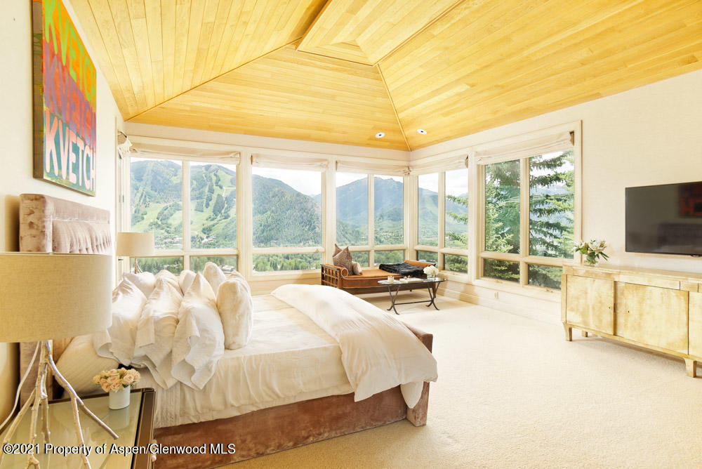 200 West Reds Road Aspen, CO 81611 - Photo 17 of 31 a large bedroom with a bed and large windows