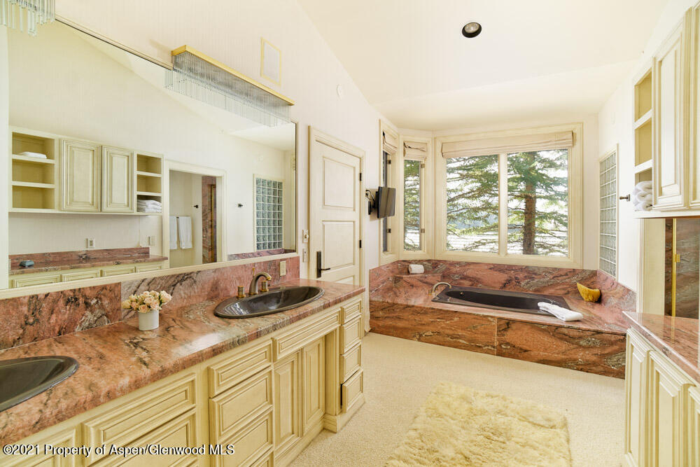 200 West Reds Road Aspen, CO 81611 - Photo 18 of 31 a bedroom with a bed and a large window