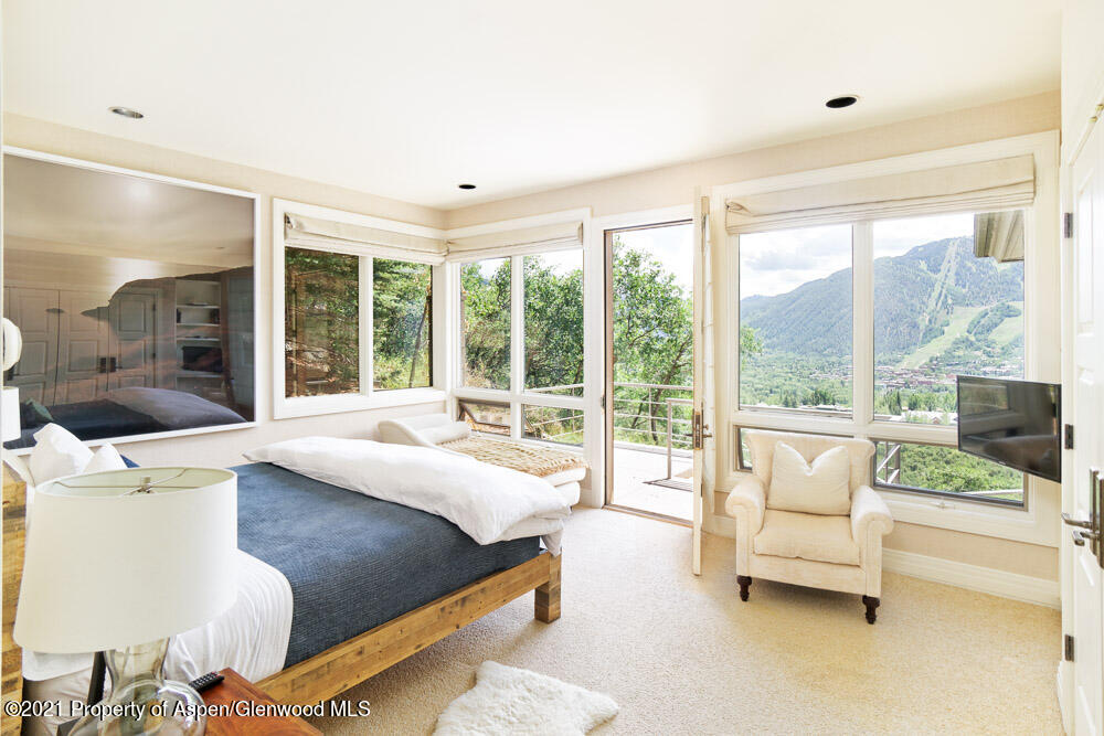 200 West Reds Road Aspen, CO 81611 - Photo 19 of 31 a bedroom with a bed and large glass window