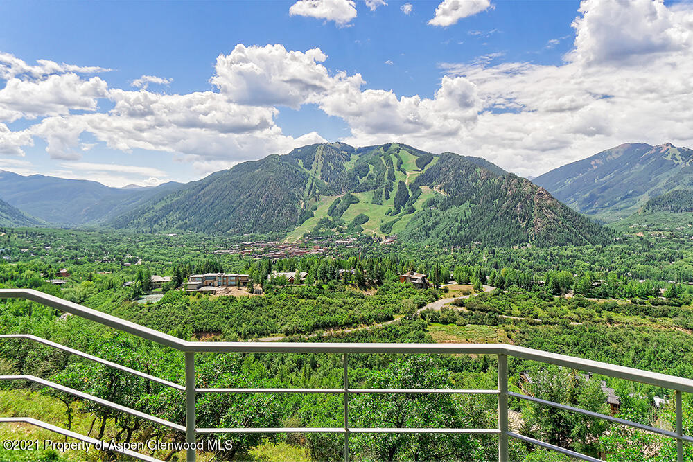 200 West Reds Road Aspen, CO 81611 - Photo 2 of 31 a view of a balcony with an umbrella