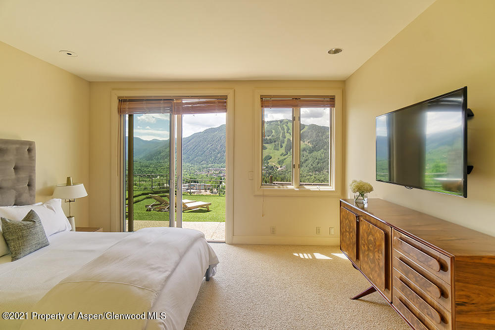 200 West Reds Road Aspen, CO 81611 - Photo 22 of 31 a bedroom with a bed and a large window