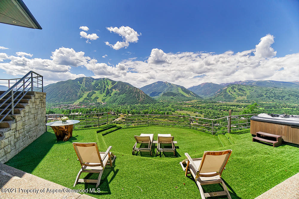 200 West Reds Road Aspen, CO 81611 - Photo 3 of 31 a view of a table and chairs in the garden