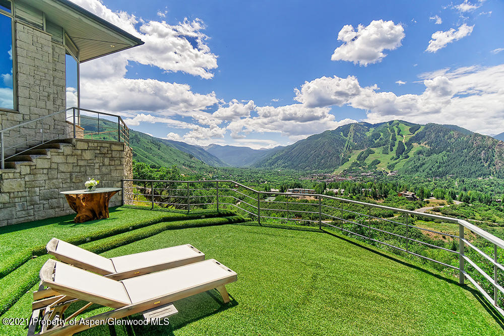 200 West Reds Road Aspen, CO 81611 - Photo 4 of 31 a green field with some trees in the background