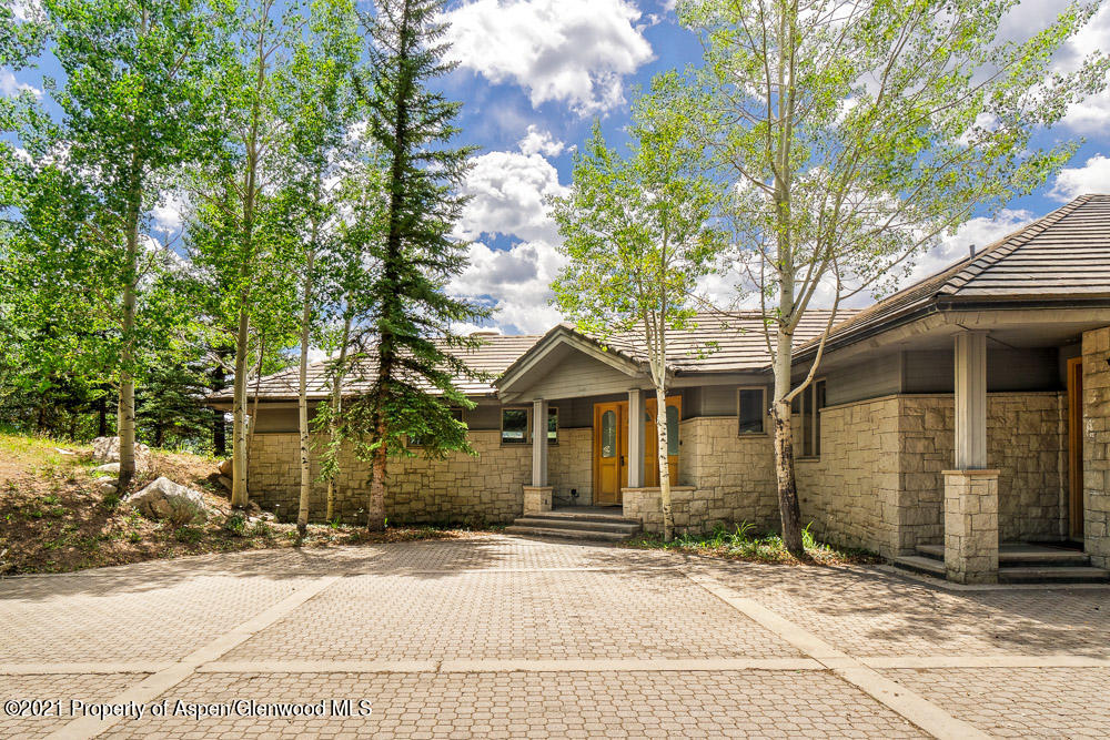 200 West Reds Road Aspen, CO 81611 - Photo 6 of 31 a front view of a house with a garden