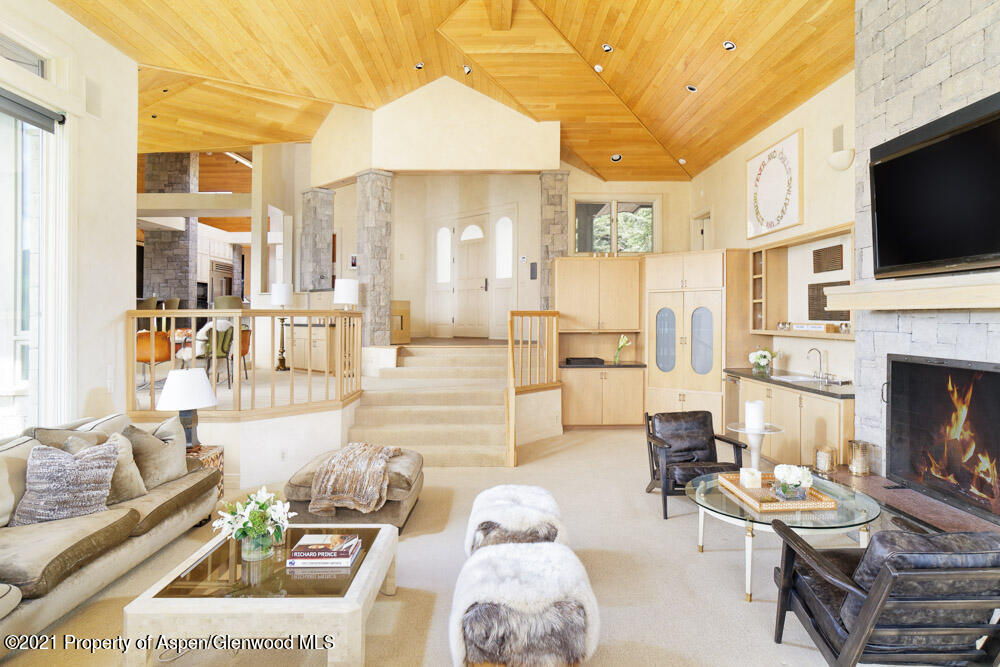 200 West Reds Road Aspen, CO 81611 - Photo 10 of 31 a living room with fireplace furniture and a flat screen tv
