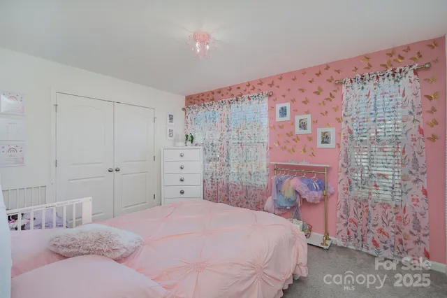 a bedroom with a bed and a cabinets