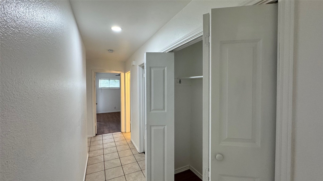 1304 Conway Drive, Unit B San Marcos, TX 78666 - Photo 11 of 16 a view of a hallway with wooden shelves