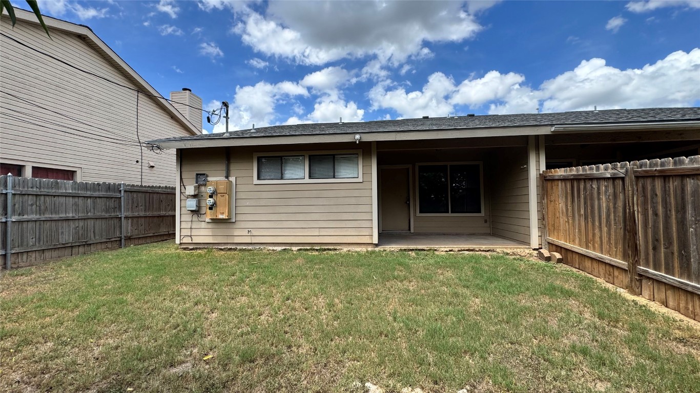 1304 Conway Drive, Unit B San Marcos, TX 78666 - Photo 15 of 16 a backyard of a house