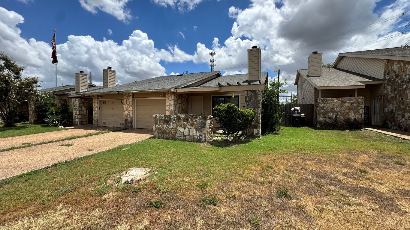 1304 Conway Drive, Unit B San Marcos, TX 78666 - Photo 16 of 16 a view of a house with a yard and pathway