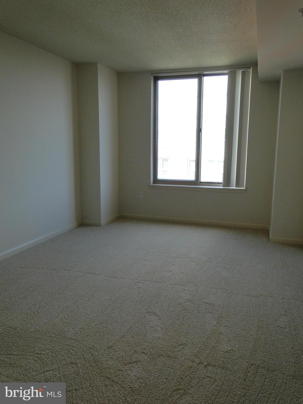 2726 Gallows Road, Unit 611 Vienna, VA 22180 - Photo 11 of 29 an empty room with a window