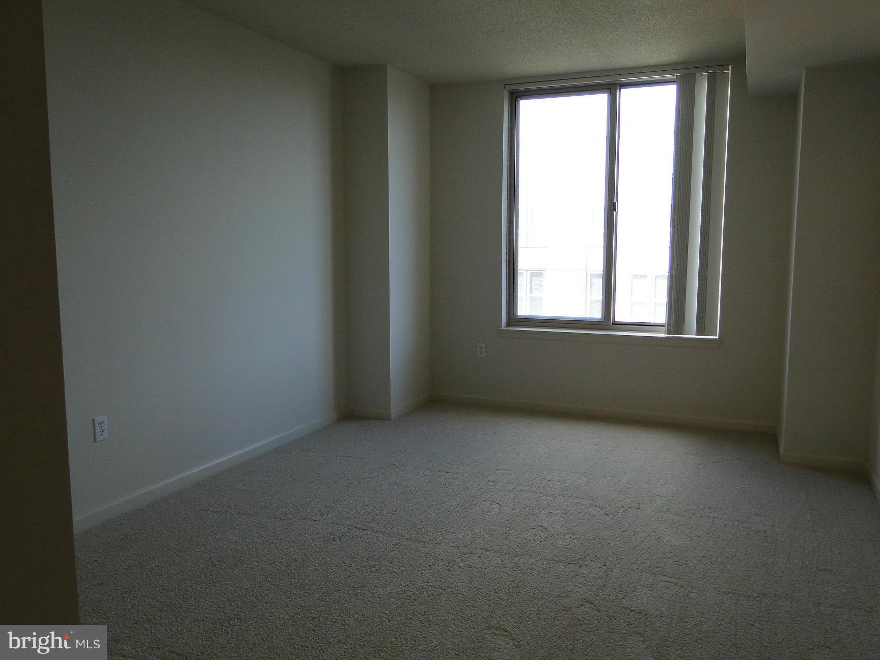 2726 Gallows Road, Unit 611 Vienna, VA 22180 - Photo 15 of 29 an empty room with a window