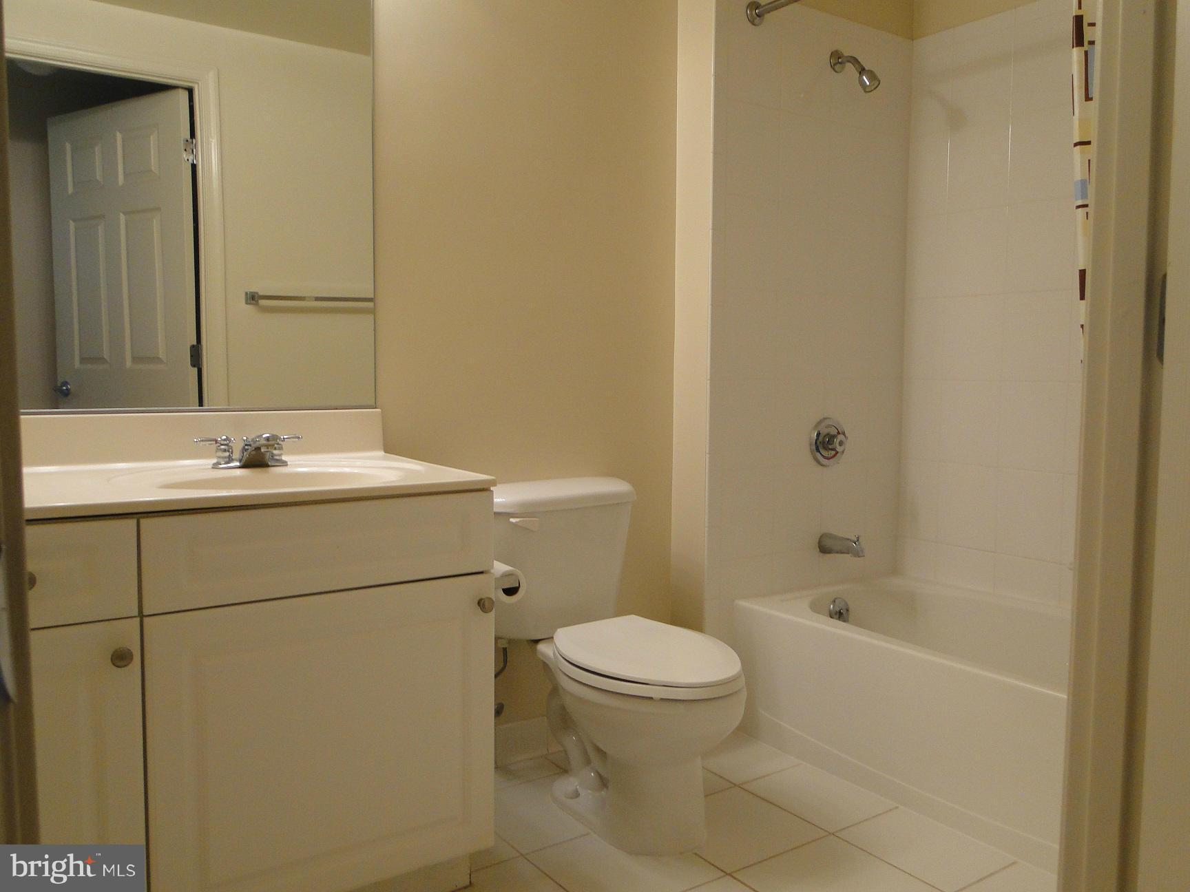 2726 Gallows Road, Unit 611 Vienna, VA 22180 - Photo 17 of 29 a bathroom with a sink toilet and shower