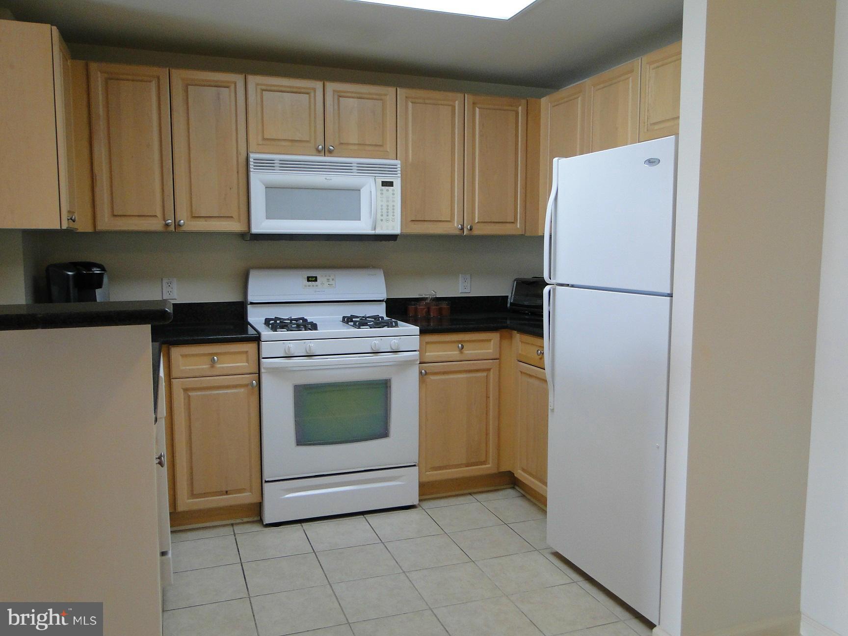2726 Gallows Road, Unit 611 Vienna, VA 22180 - Photo 3 of 29 a kitchen with a stove a refrigerator and a sink