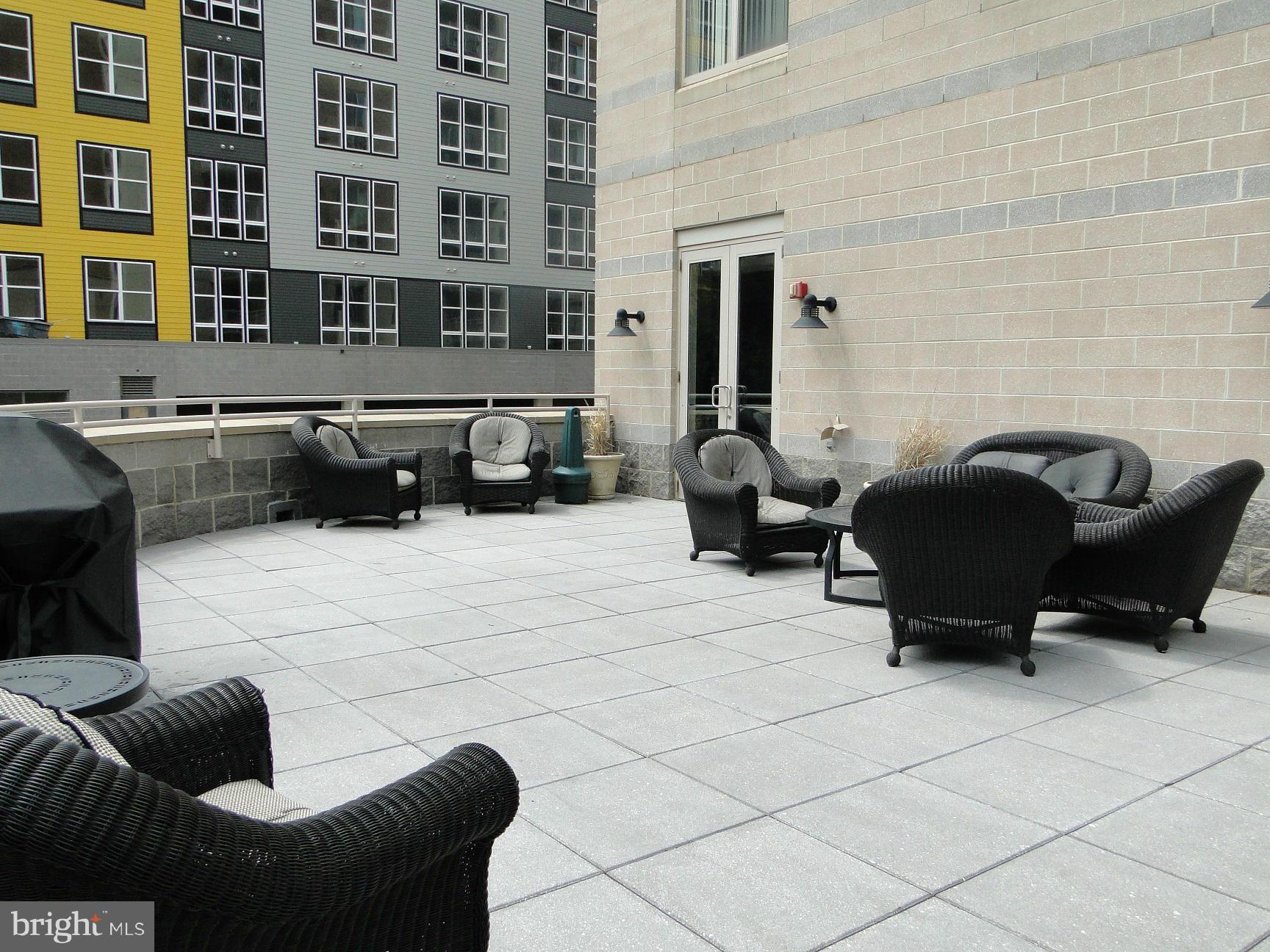 2726 Gallows Road, Unit 611 Vienna, VA 22180 - Photo 25 of 29 a building outdoor space with patio furniture