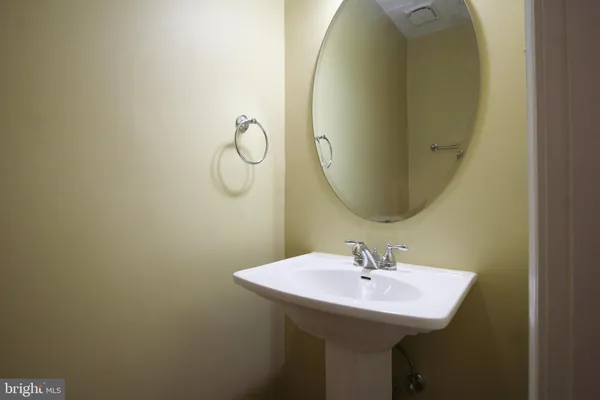 a bathroom with a sink and mirror