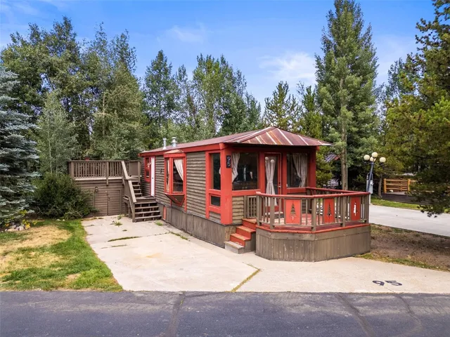 a view of house with outdoor space and sitting area