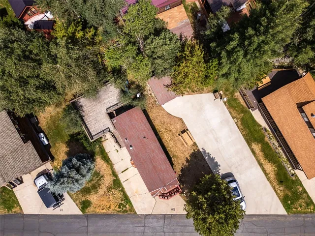 an aerial view of a house with outdoor space