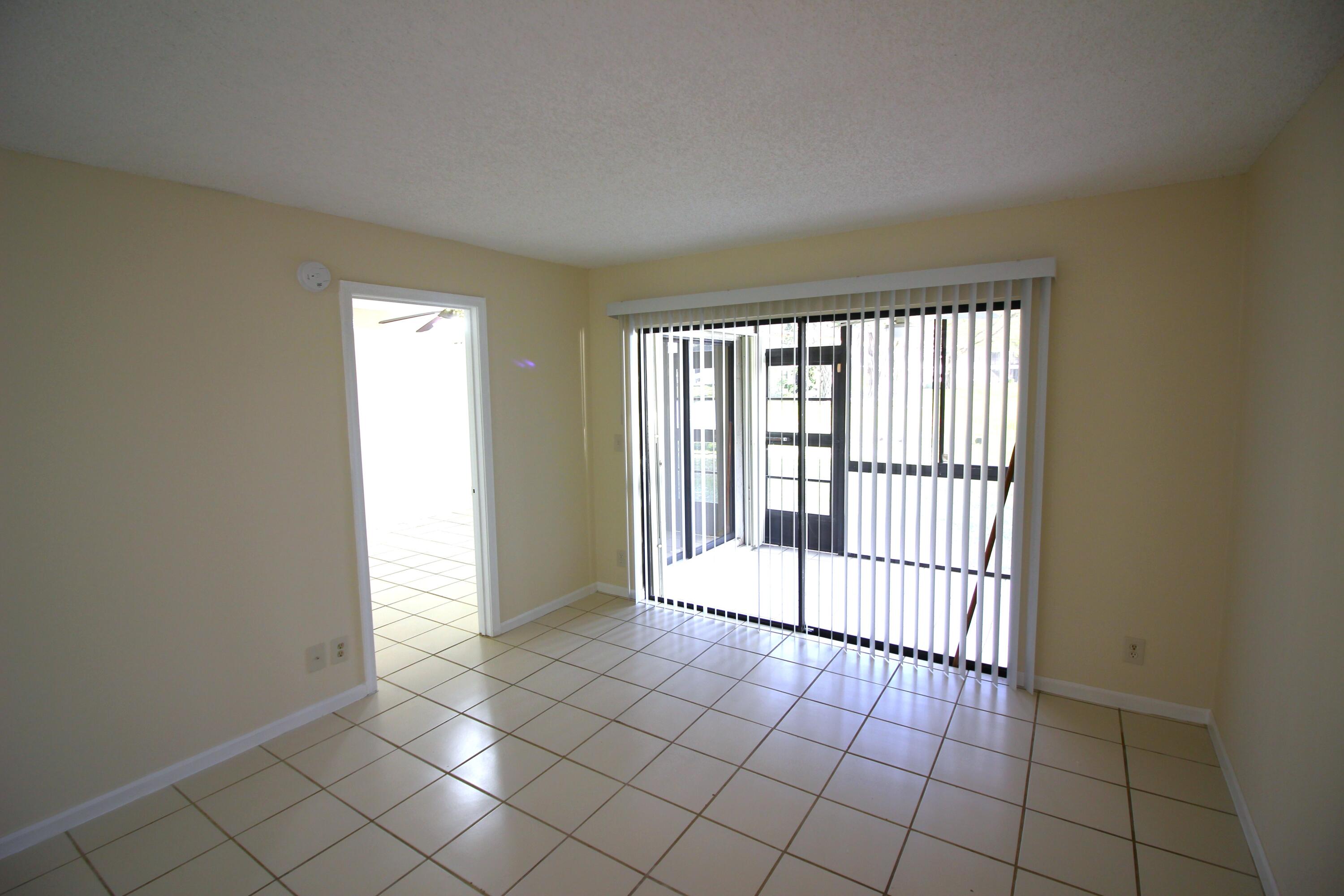 320 Olivewood Place, Unit O115 Boca Raton, FL 33431 - Photo 14 of 56 a view of an empty room and window