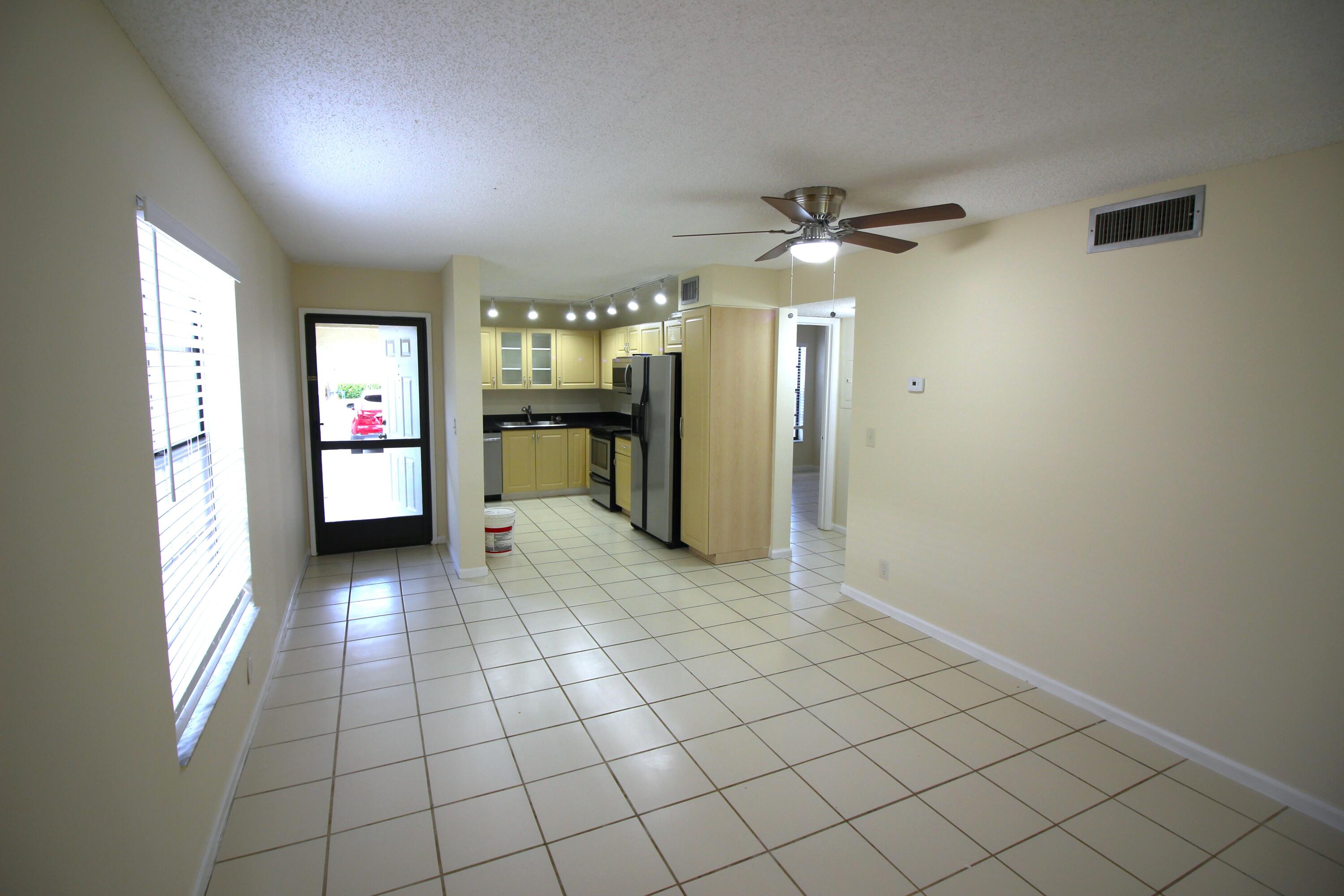 320 Olivewood Place, Unit O115 Boca Raton, FL 33431 - Photo 15 of 56 a view of a livingroom with a chandelier