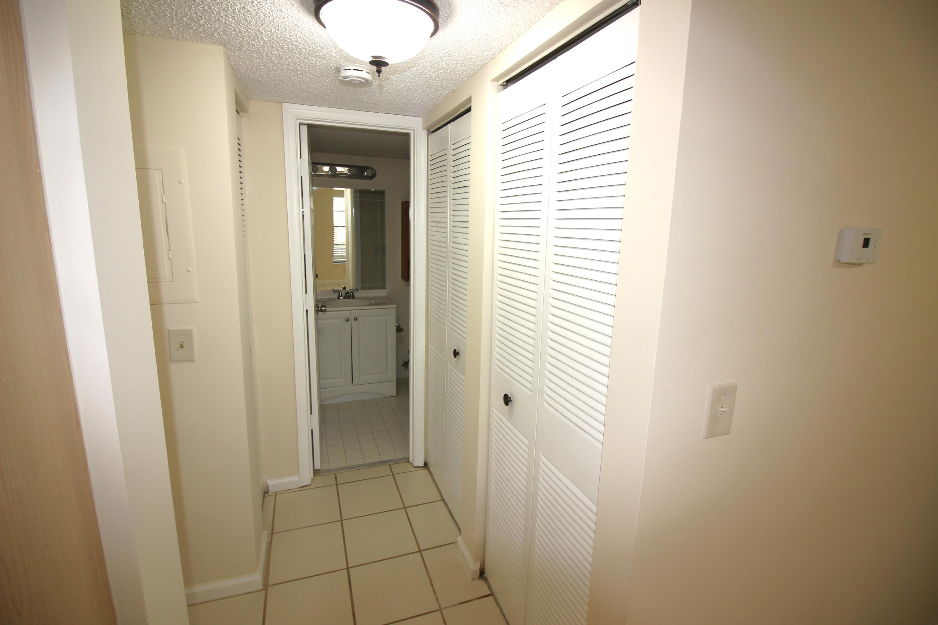 320 Olivewood Place, Unit O115 Boca Raton, FL 33431 - Photo 16 of 56 a bathroom with a shower and a sink