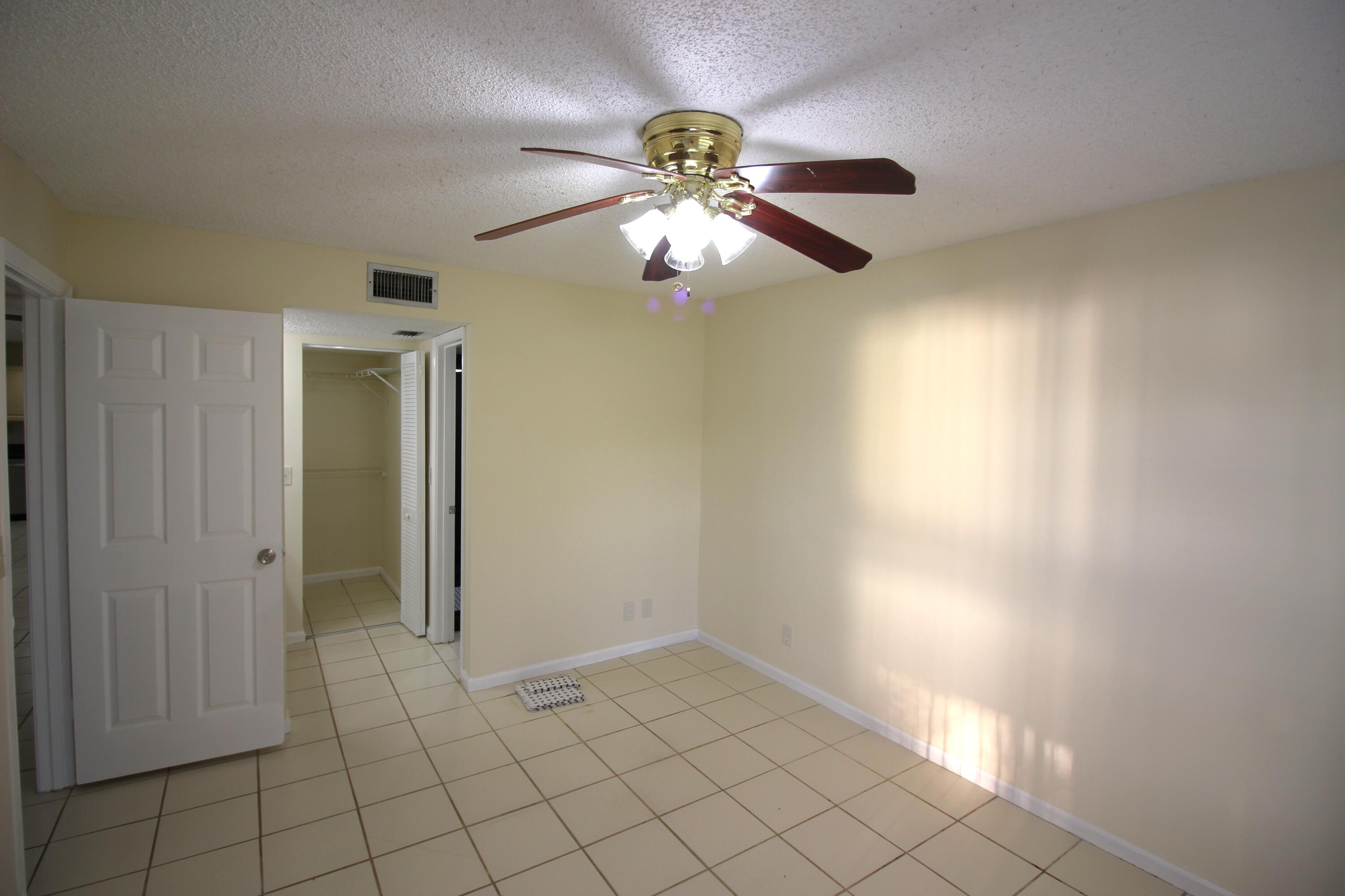 320 Olivewood Place, Unit O115 Boca Raton, FL 33431 - Photo 23 of 56 a view of an empty room and window