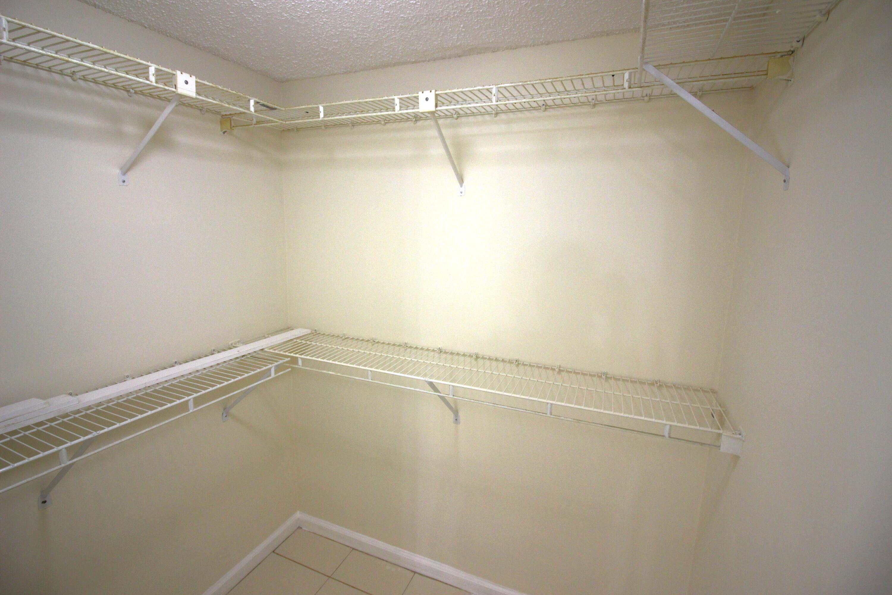 320 Olivewood Place, Unit O115 Boca Raton, FL 33431 - Photo 29 of 56 a view of a room with racks on the wall