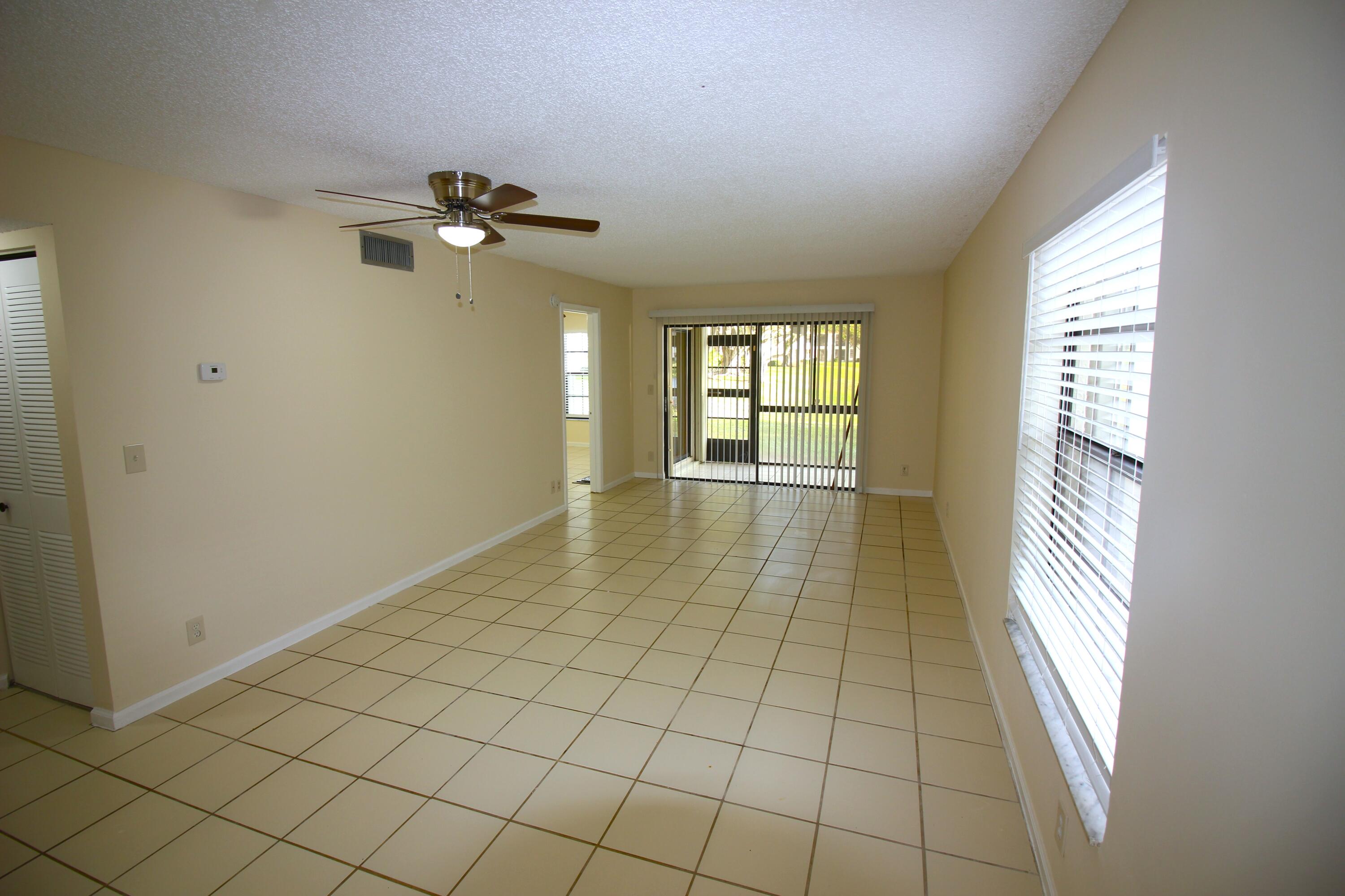 320 Olivewood Place, Unit O115 Boca Raton, FL 33431 - Photo 4 of 56 a view of an empty room and window