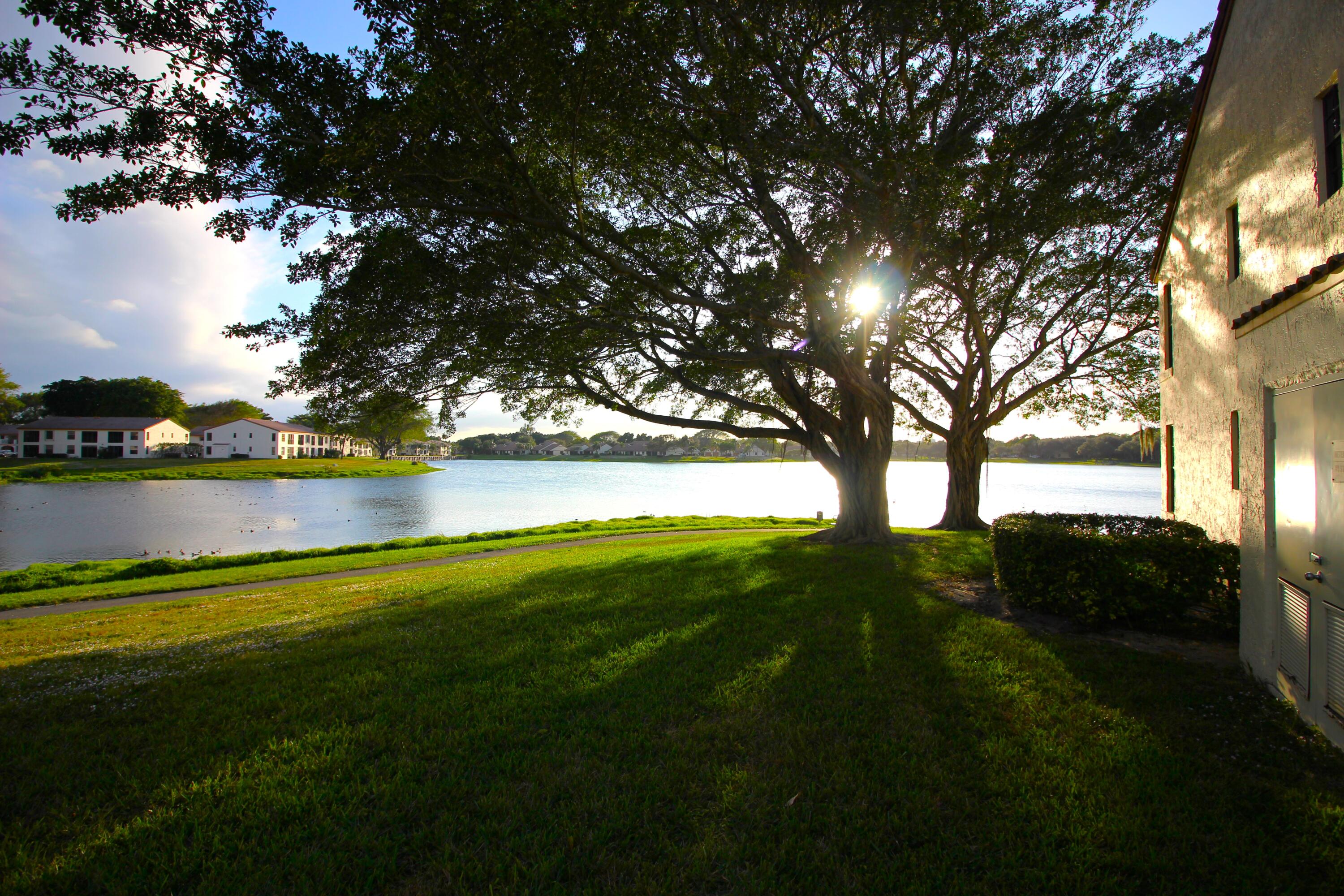 320 Olivewood Place, Unit O115 Boca Raton, FL 33431 - Photo 42 of 56 a view of outdoor space with deck and yard