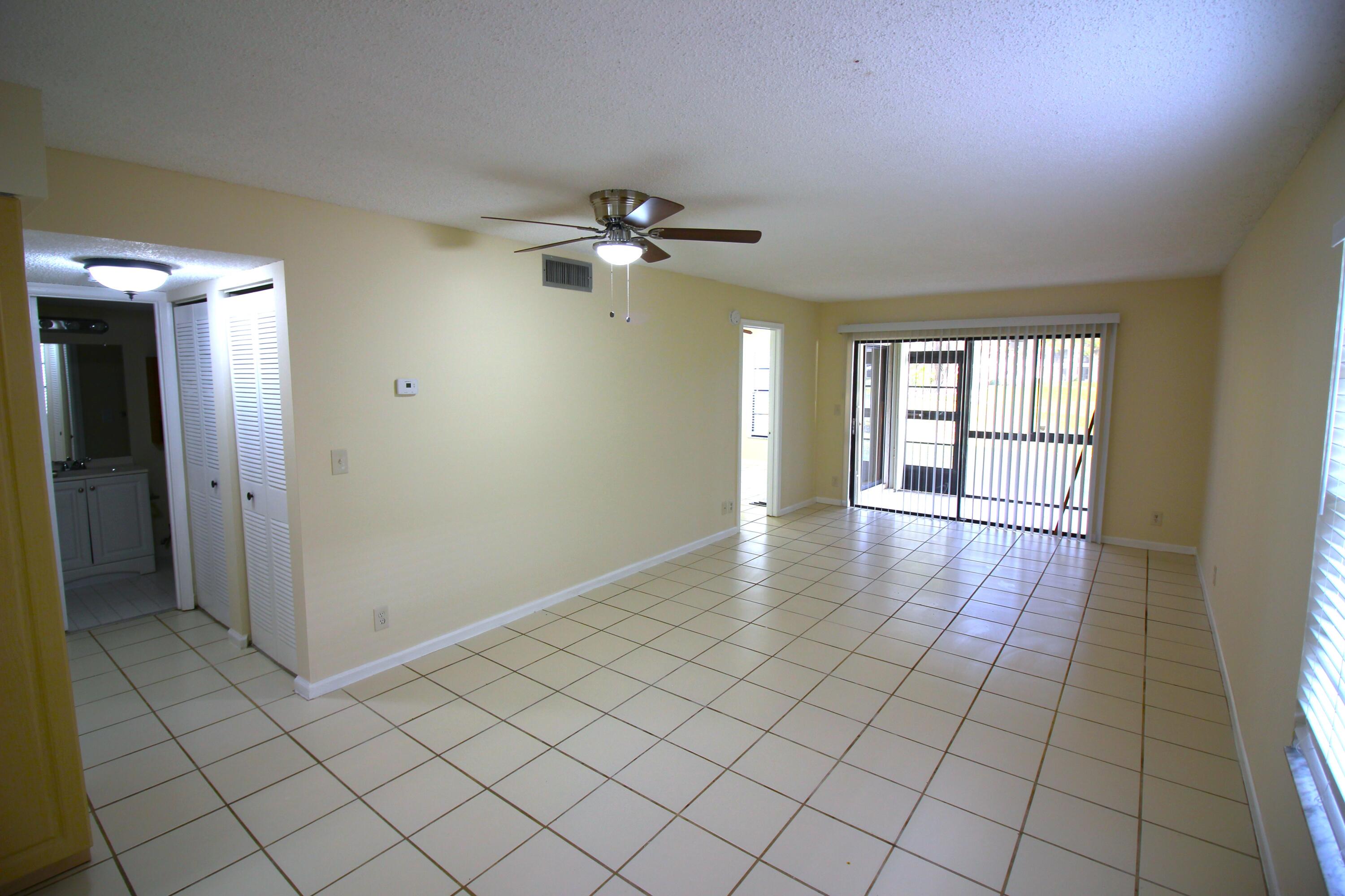 320 Olivewood Place, Unit O115 Boca Raton, FL 33431 - Photo 5 of 56 a view of an empty room with a window