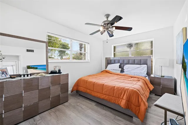 a bedroom with bed and window