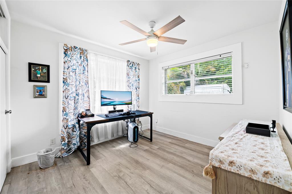 1357 Southwest 4th Terrace Pompano Beach, FL 33060 - Photo 15 of 25 a bedroom with a bed and a window