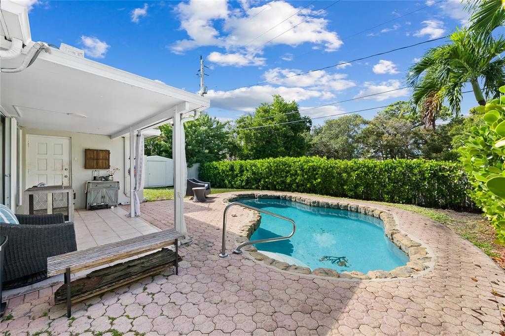 1357 Southwest 4th Terrace Pompano Beach, FL 33060 - Photo 20 of 25 a view of swimming pool with seating space