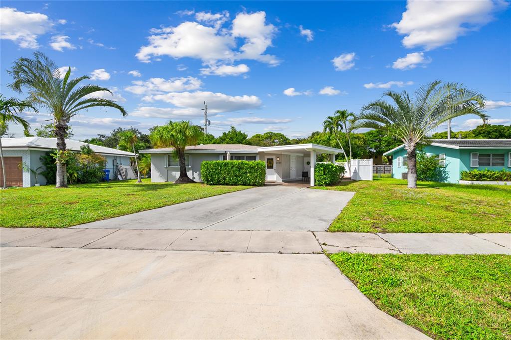 1357 Southwest 4th Terrace Pompano Beach, FL 33060 - Photo 2 of 25 a view of a garden with a apartment