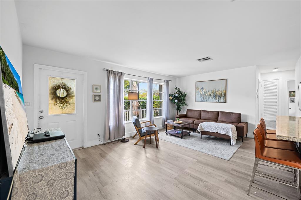 1357 Southwest 4th Terrace Pompano Beach, FL 33060 - Photo 9 of 25 a living room with furniture and wooden floor