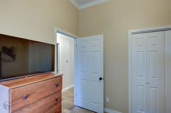 a view of room with wooden floor